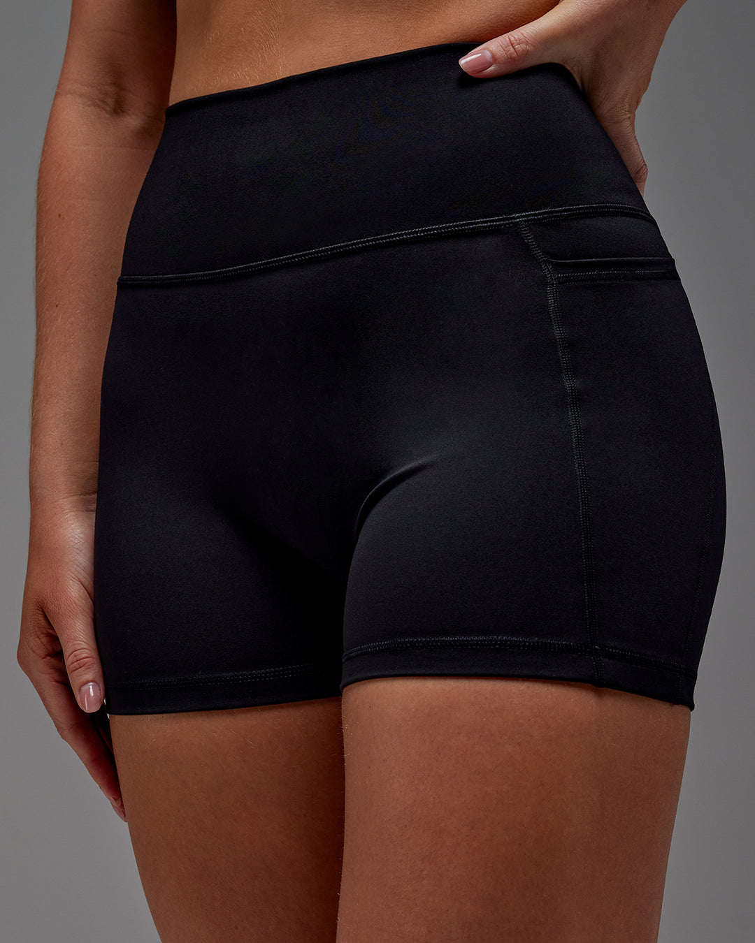 Woman wearing Fusion X-Short Tight With Pockets in Black | Model:Meg | Size:M