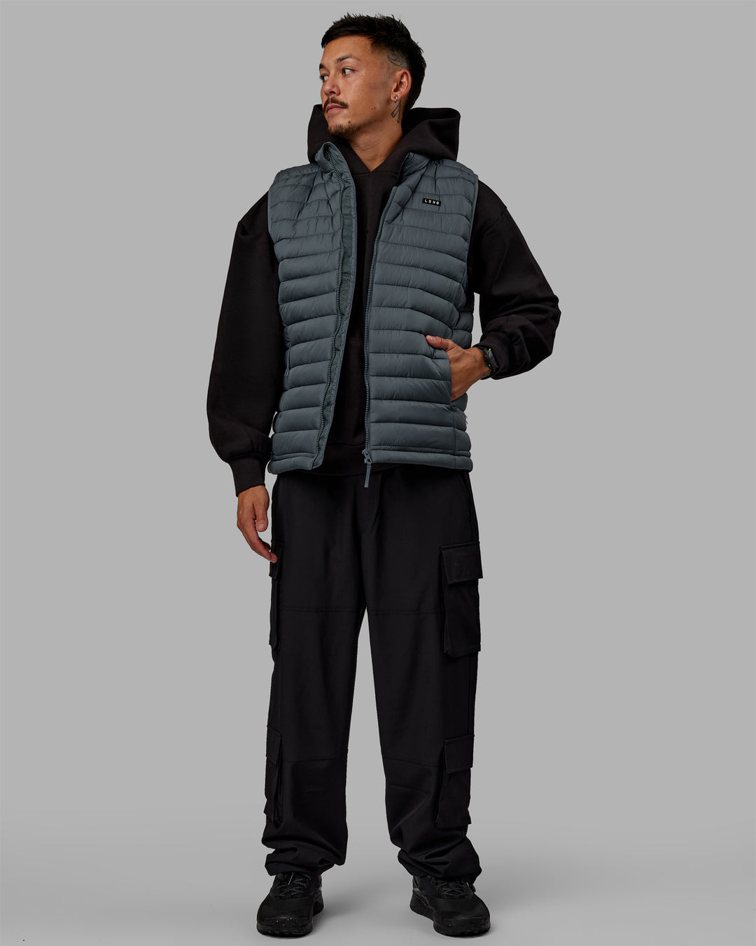 Man wearing All Day Puffer Vest - Storm