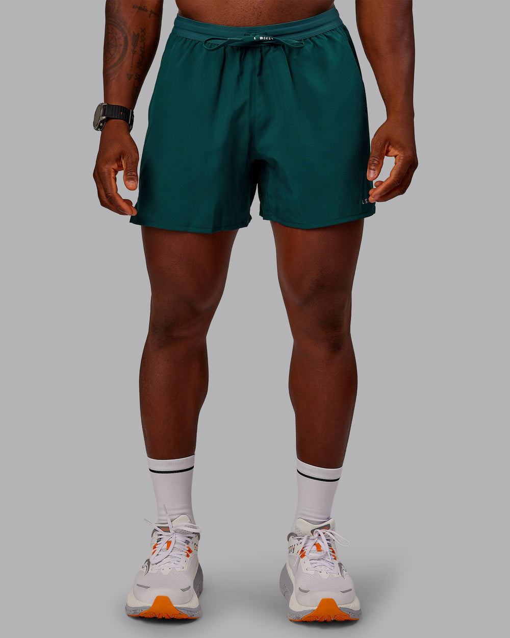 Man wearing Pace Lined Performance Short  5" in Dark Moss | Size:M