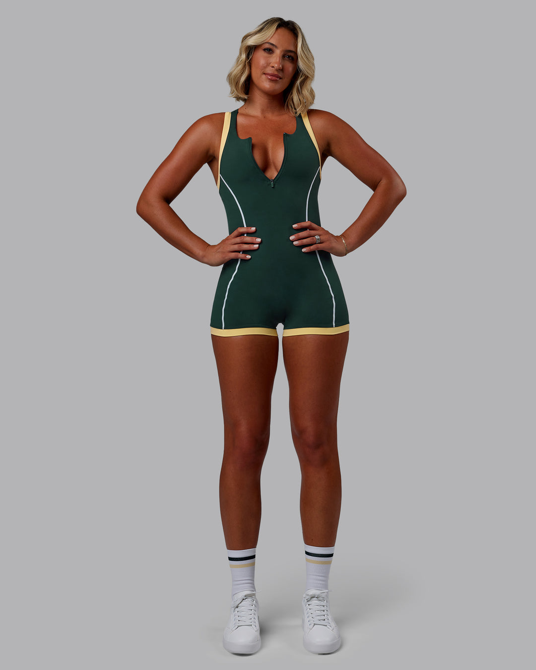 Woman wearing Patty Mills Pace Sprinting Suit - Vital Green-Pale Banana