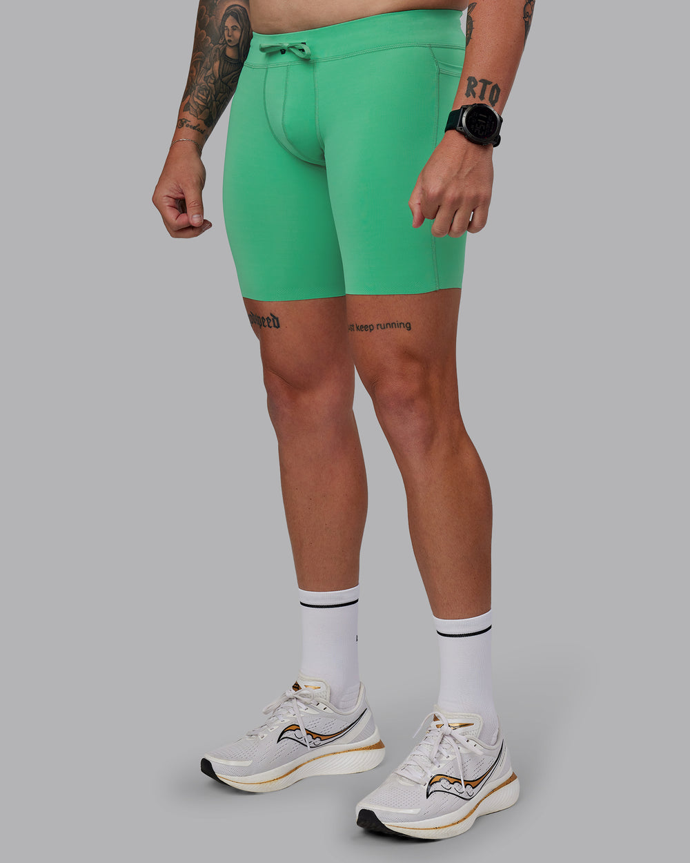 Man wearing Race Day Short Tight 8" in Mystic Green | Size:M