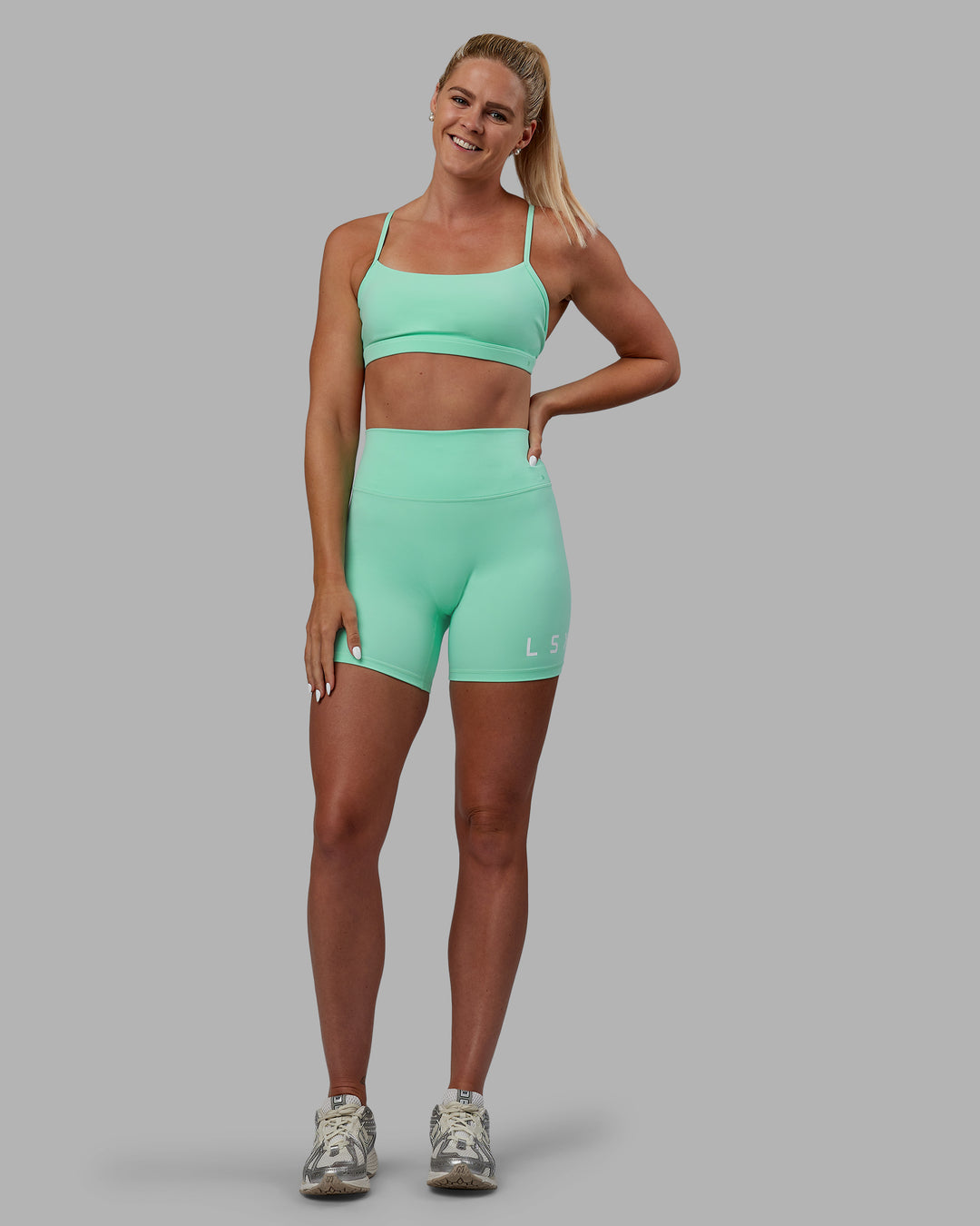 Woman wearing Resilient Sports Bra - Ice Green