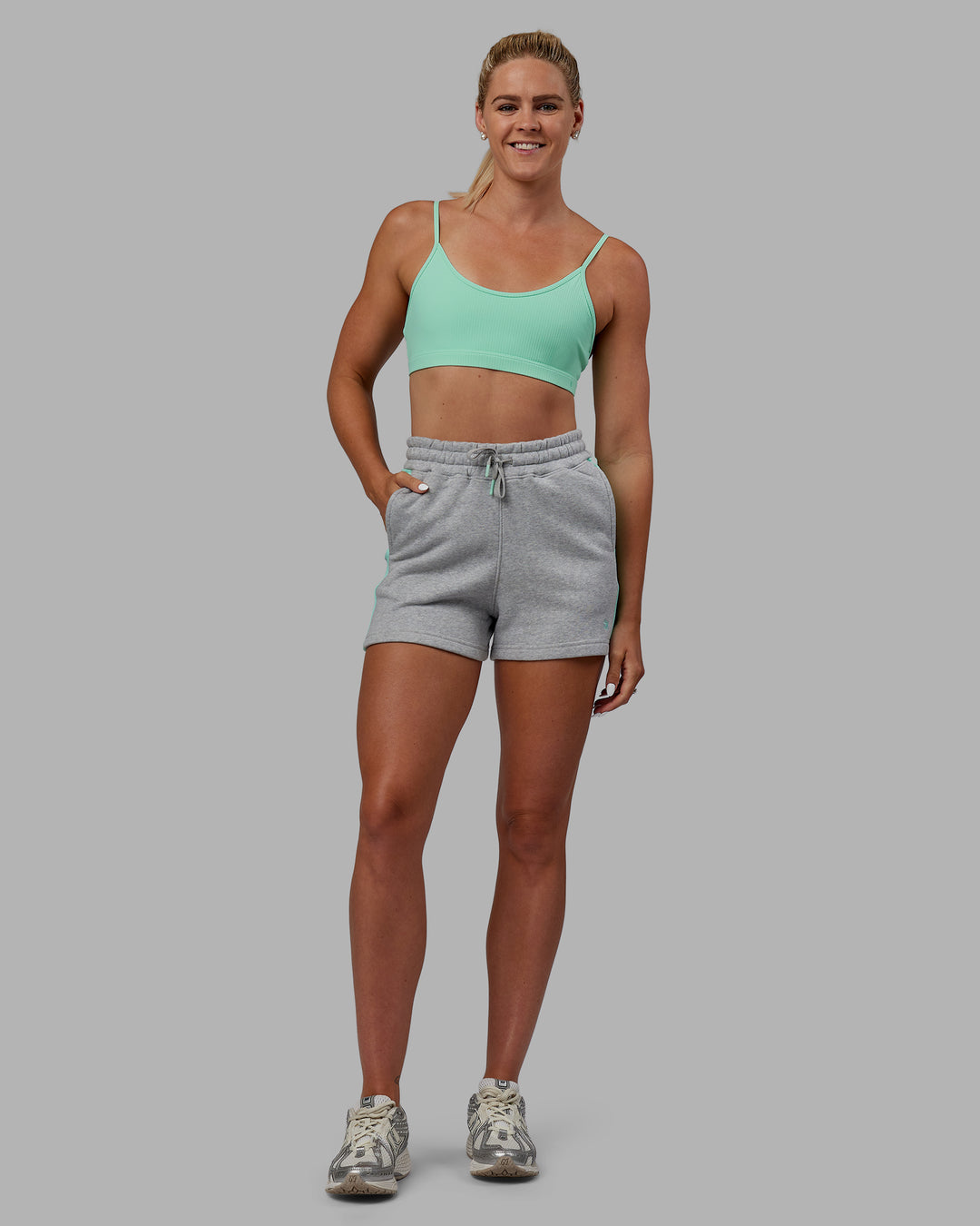 Woman wearing Tenacity Lounge Shorts - Light Grey Marl-Ice Green