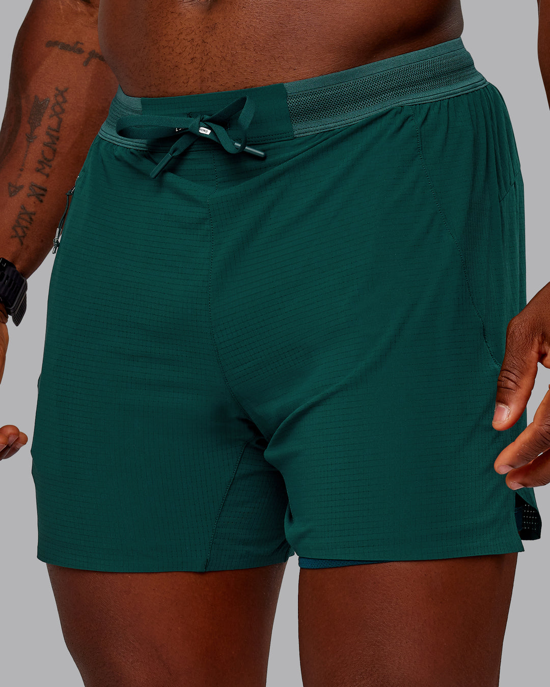 Man wearing UltraAir 5&quot; Lined Performance Short in Dark Moss | Size:M