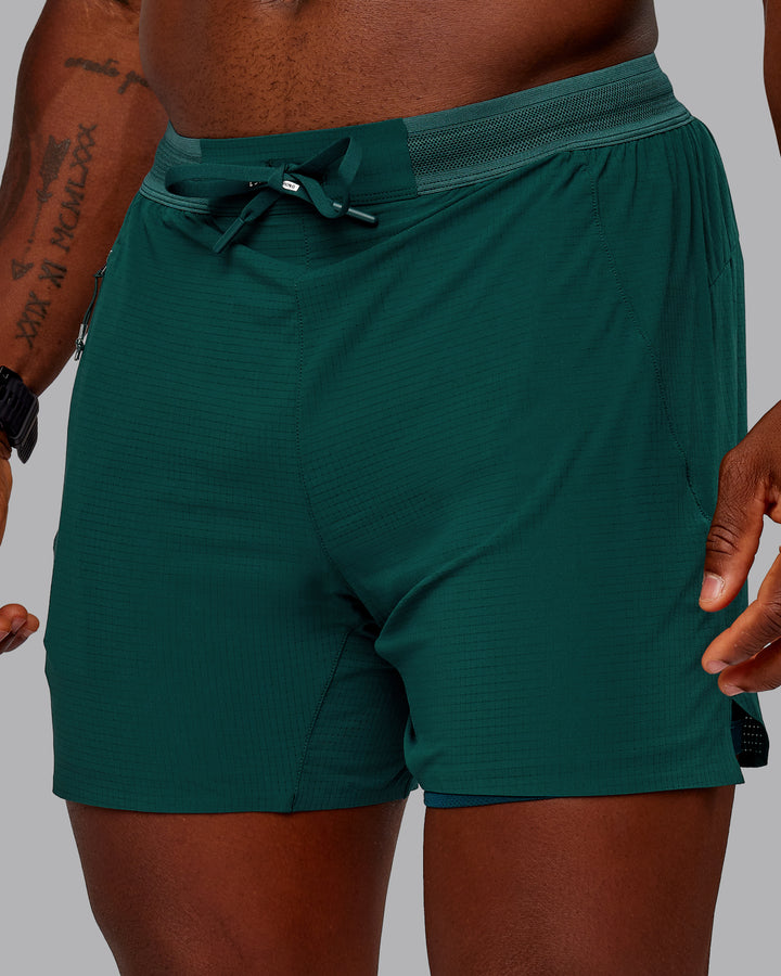 Man wearing UltraAir 5&quot; Lined Performance Short in Dark Moss | Size:M
