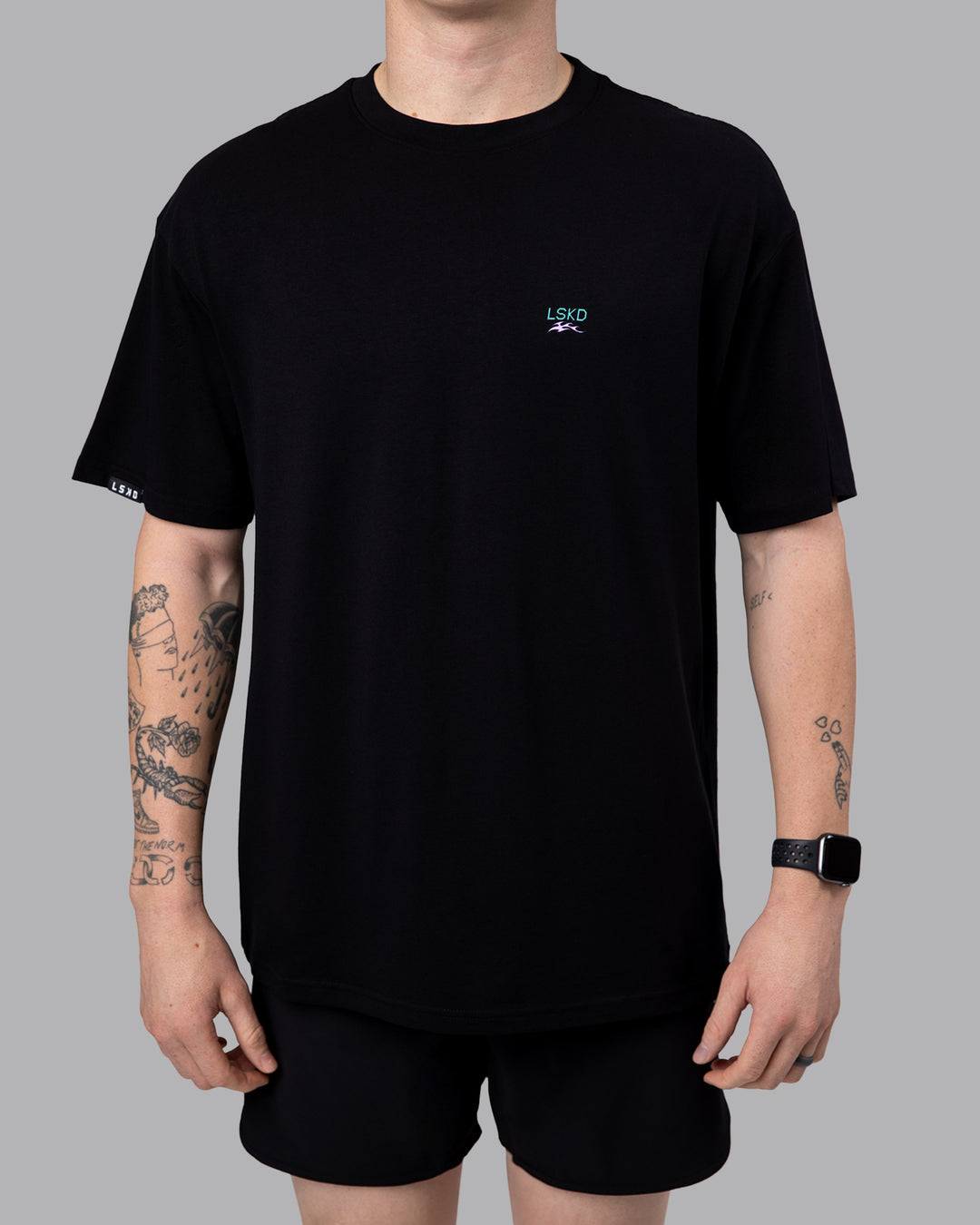 Man wearing Digital World Tee FLXCotton Oversize in Black | Size:M