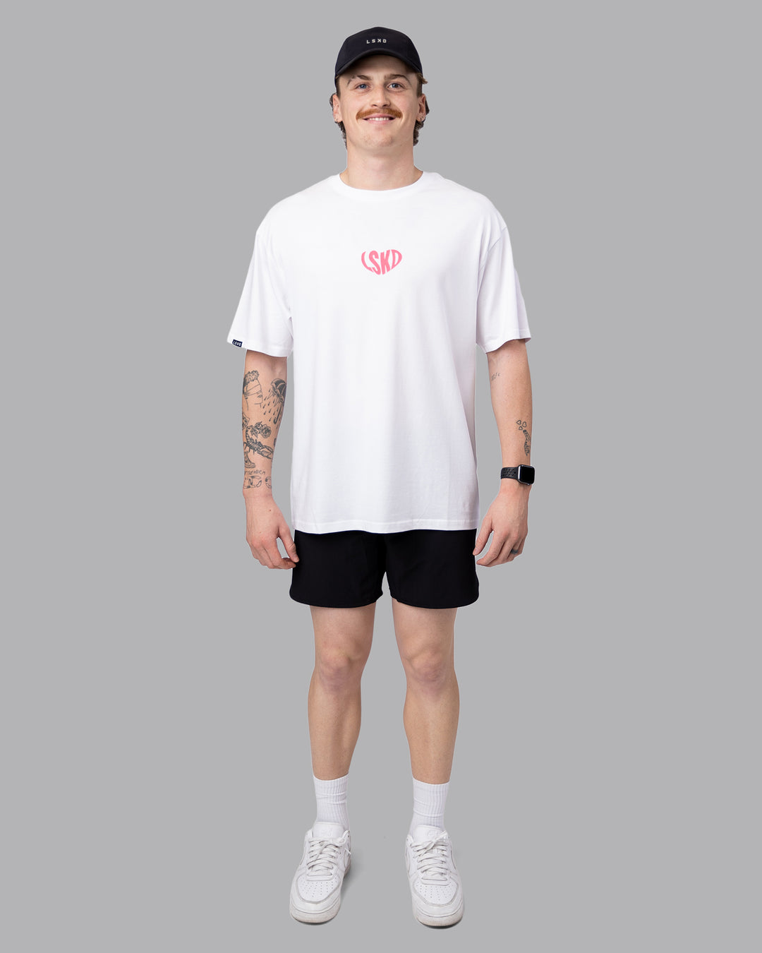 Man wearing Unisex Love To Train FLXCotton Tee Oversize - White-Pink Lemonade | Size:M