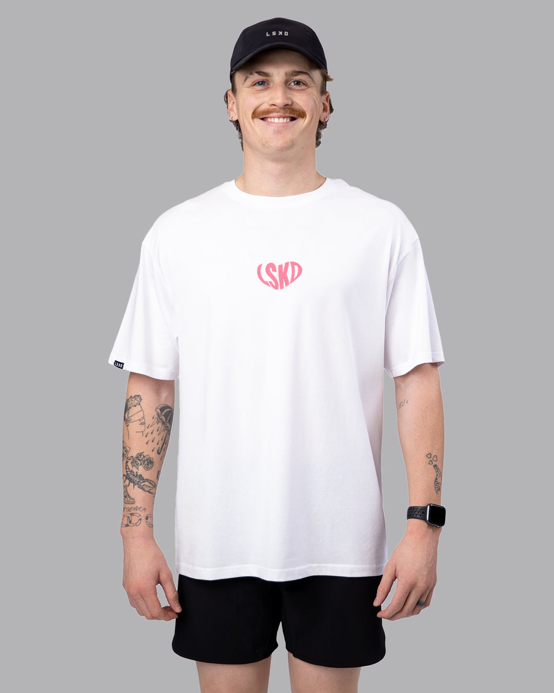 Man wearing Unisex Love To Train FLXCotton Tee Oversize - White-Pink Lemonade | Size:M