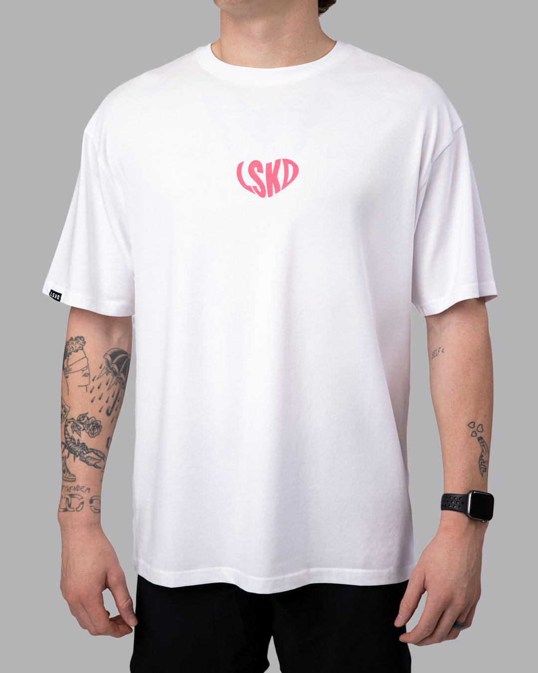 Man wearing Unisex Love To Train FLXCotton Tee Oversize - White-Pink Lemonade | Size:M