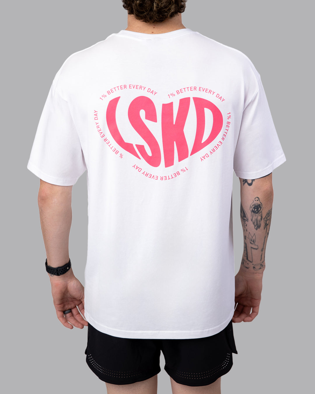 Man wearing Unisex Love To Train FLXCotton Tee Oversize - White-Pink Lemonade | Size:M