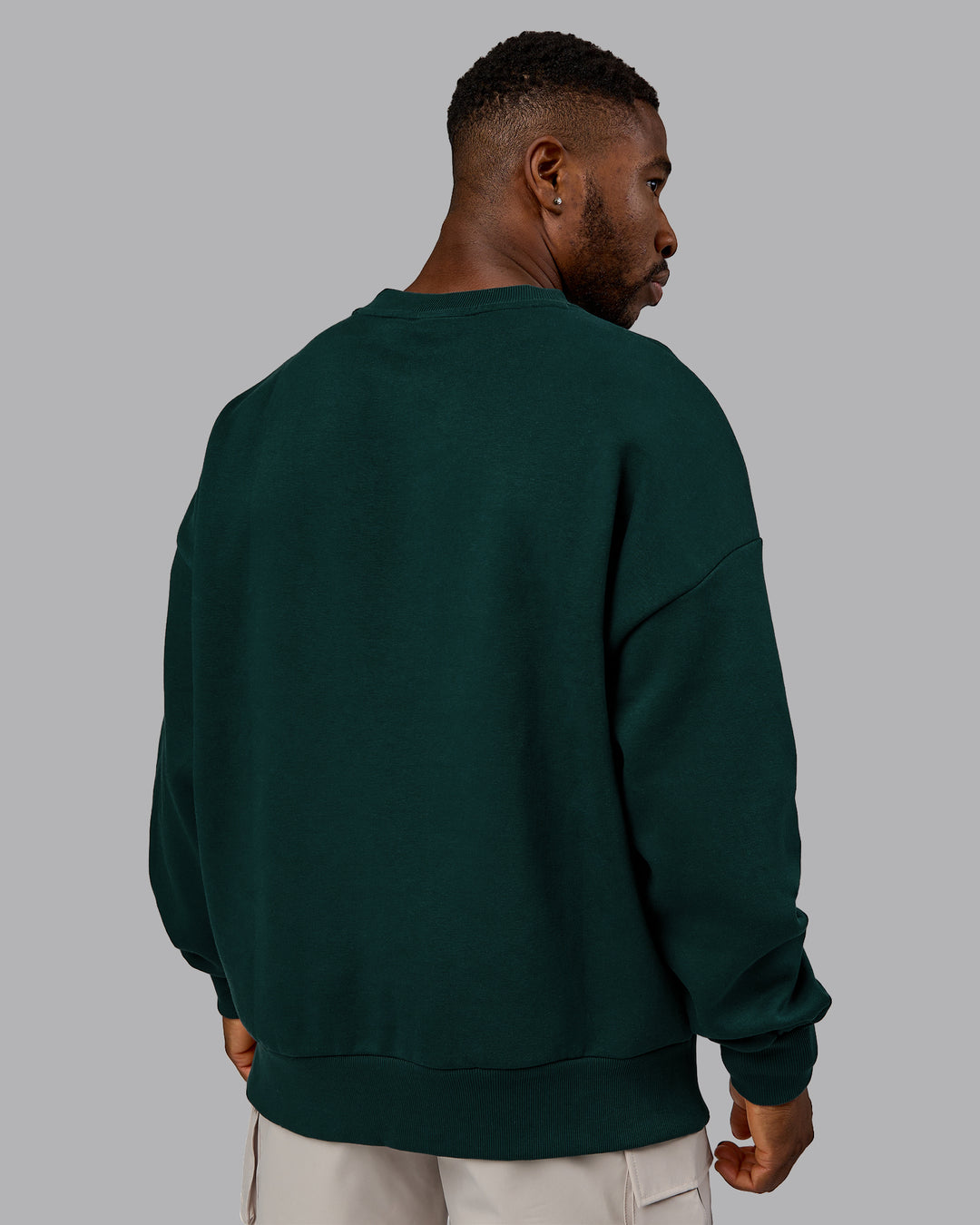 Man wearing MVP Oversized Sweater in Dark Moss | Size:M | Model:Sam