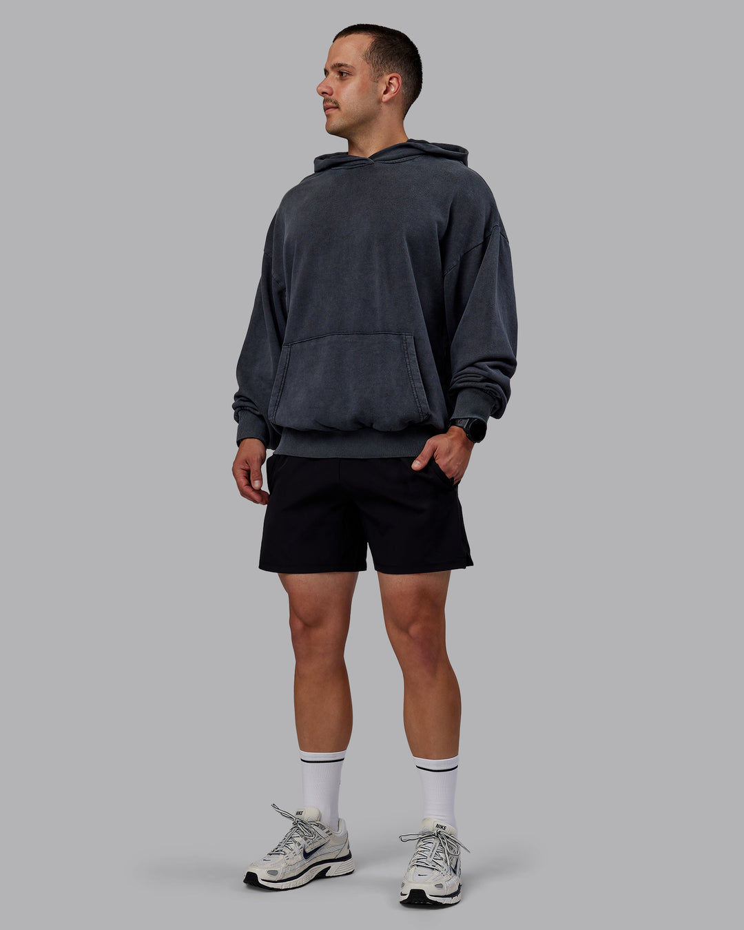 Man wearing Set the Standard Washed Oversized Hoodie in Black-Black | Size:M