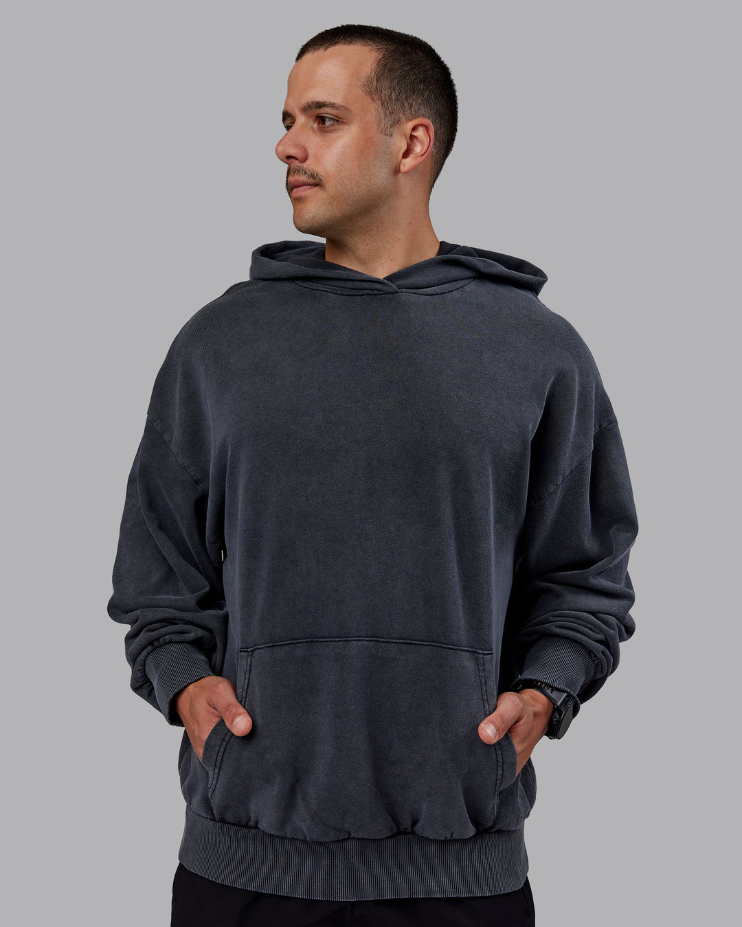 Man wearing Set the Standard Washed Oversized Hoodie in Black-Black | Size:M