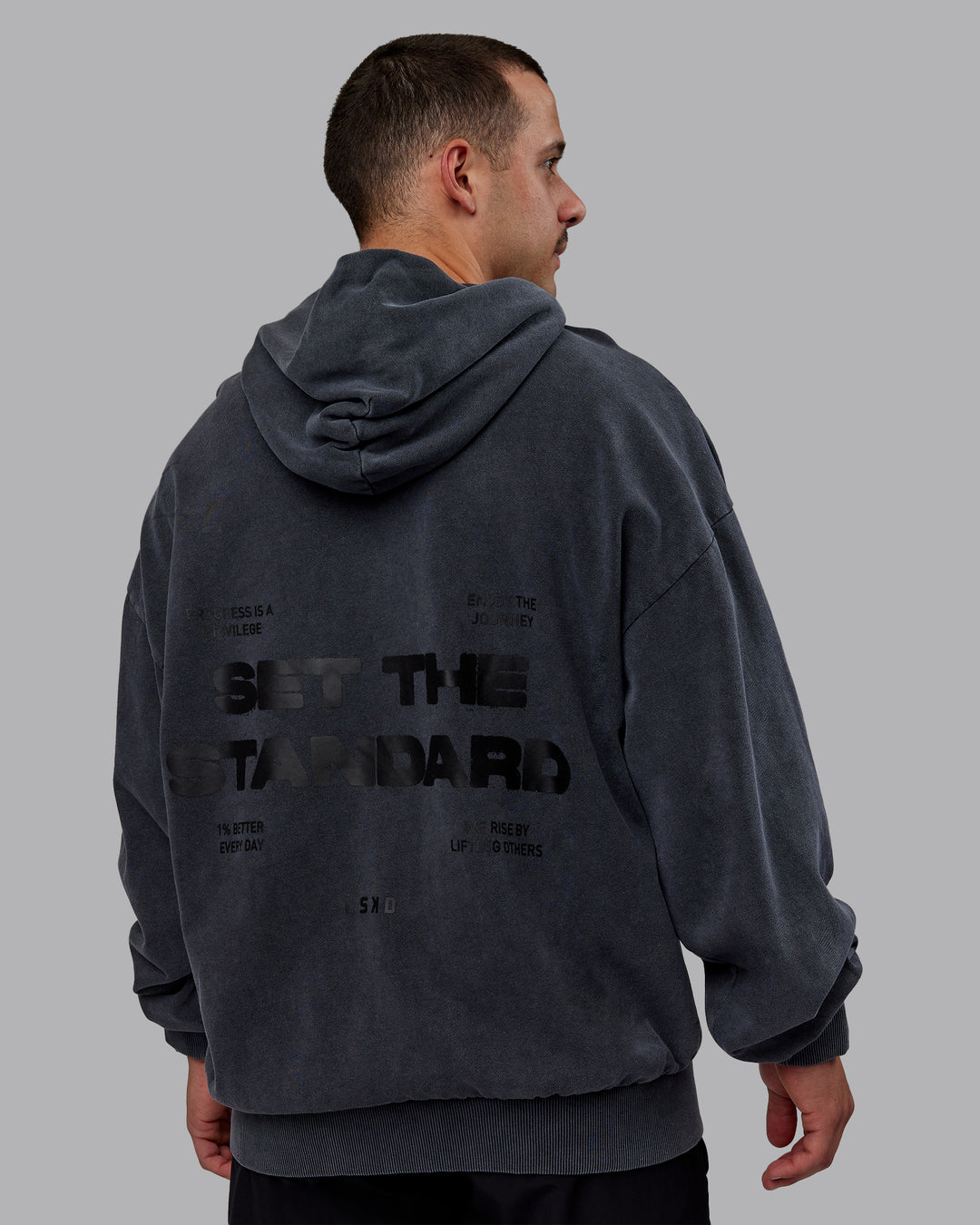 Man wearing Set the Standard Washed Oversized Hoodie in Black-Black | Size:M