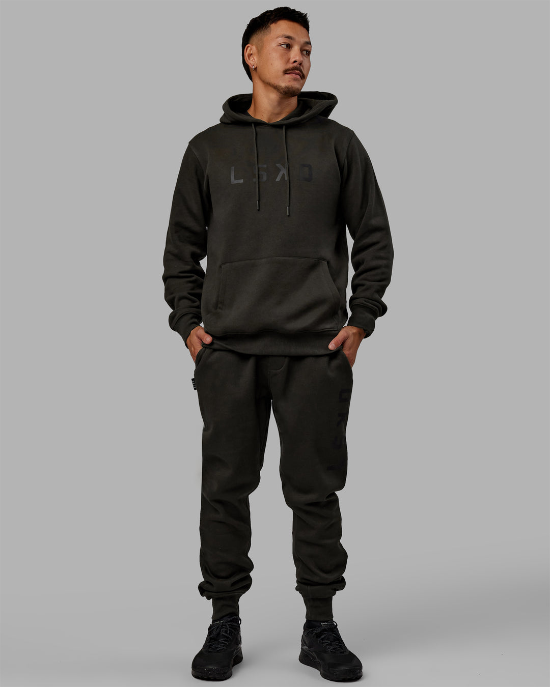 Man wearing Unisex Structure Track Pants - Pirate Black-Black