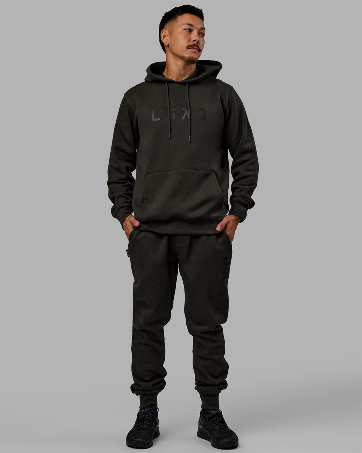 Man wearing Unisex Structure Track Pants - Pirate Black-Black
