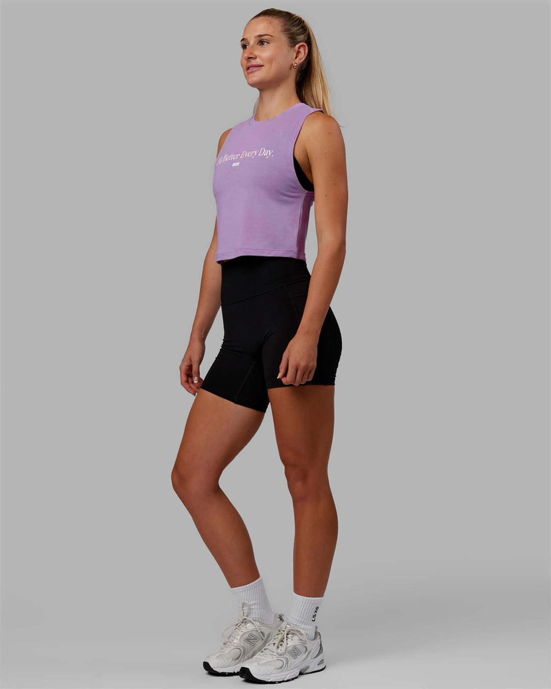 Woman wearing 1% Better Training Tank - Lilac-White