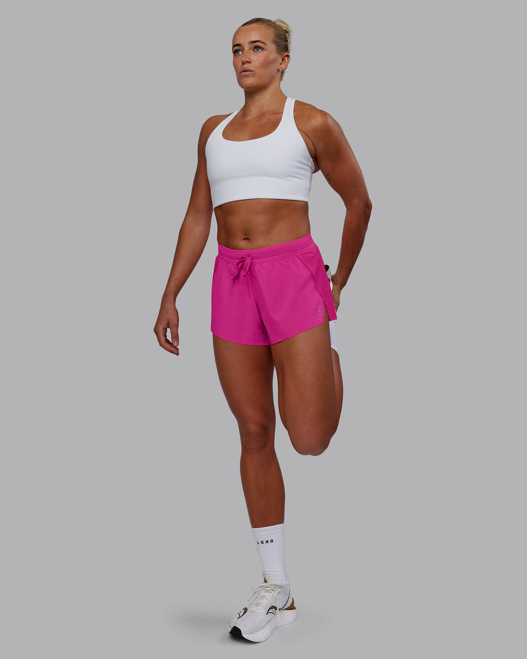 Woman wearing Accelerate Run Shorts - Ultra Pink