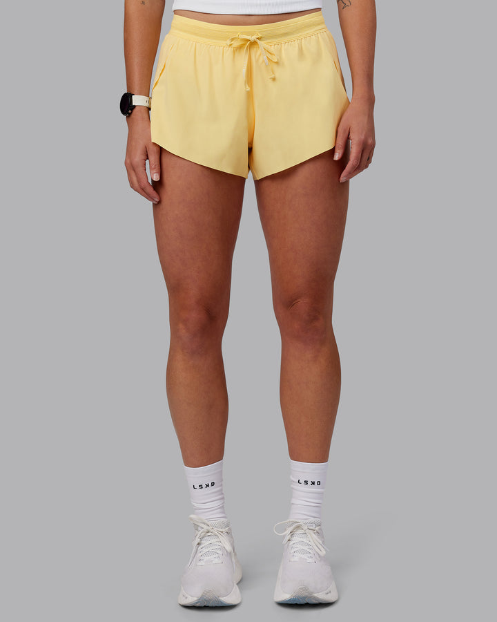 Woman wearing Accelerate 3&quot; Run Shorts - Sunflower
