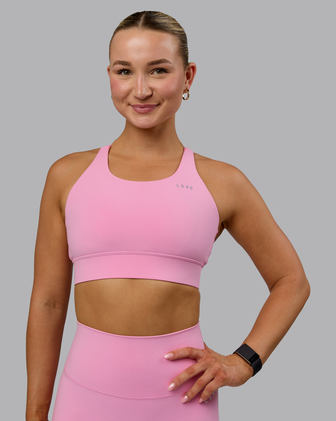 Woman wearing Accelerate Sports Bra - Bubblegum