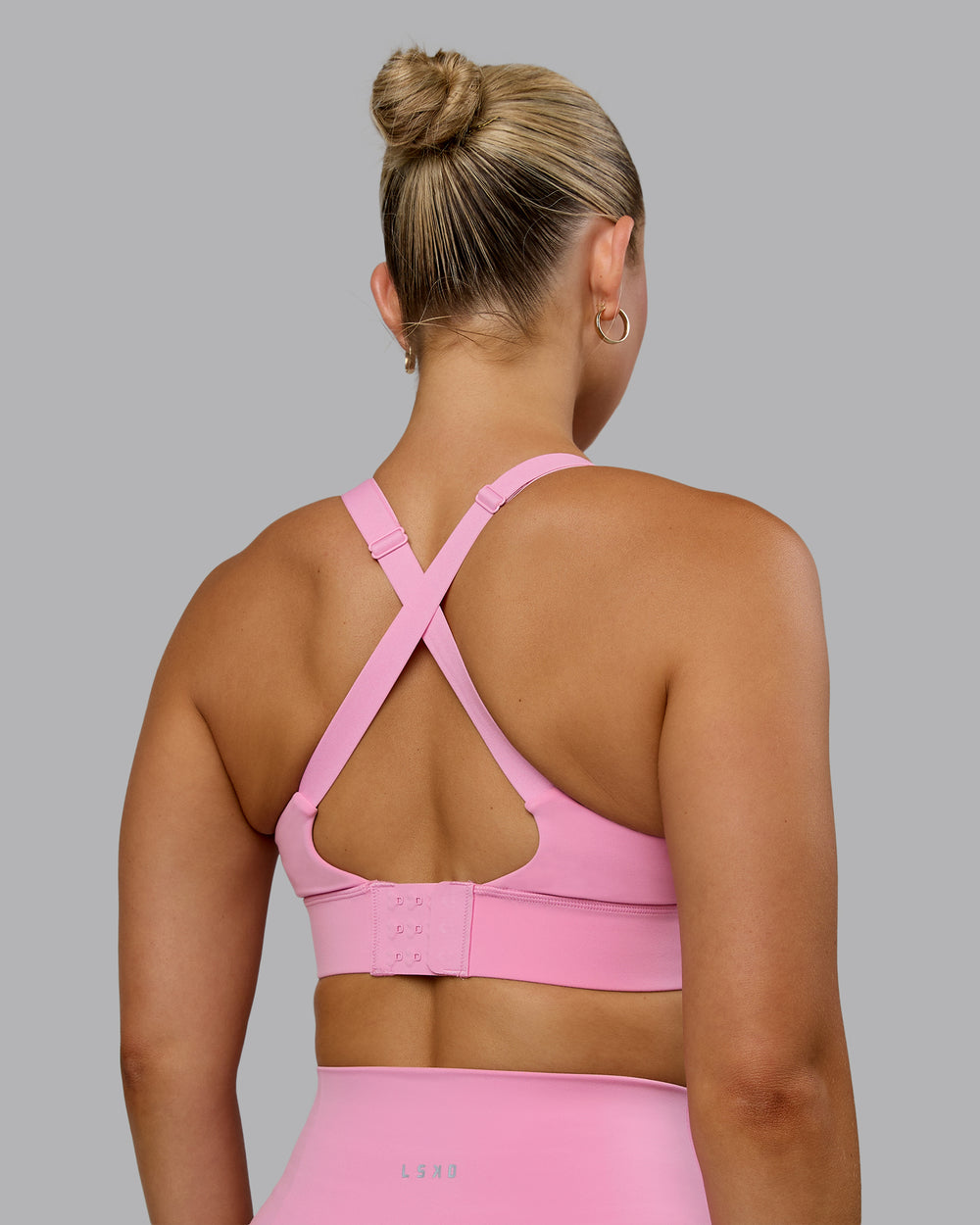 Woman wearing Accelerate Sports Bra - Bubblegum