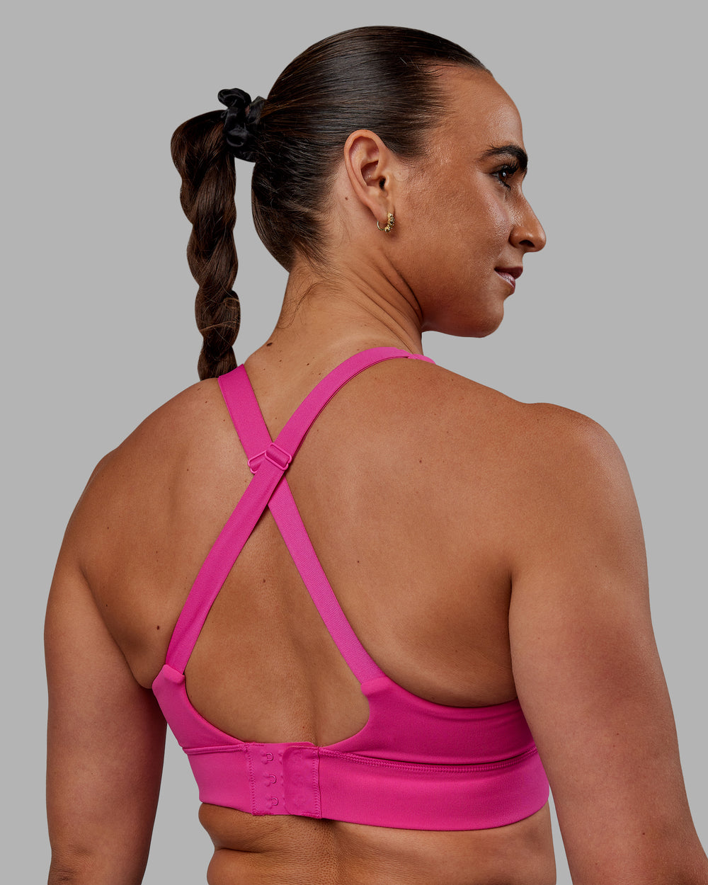 Woman wearing Accelerate Sports Bra - Fuchsia Pink