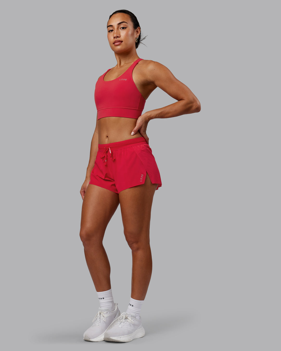 Woman wearing Accelerate Sports Bra - Scarlet