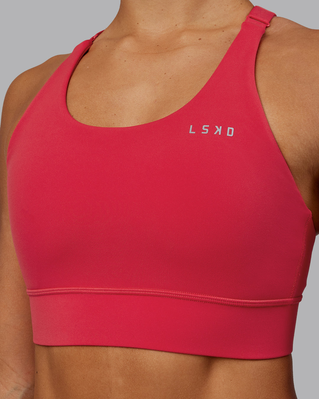 Woman wearing Accelerate Sports Bra - Scarlet