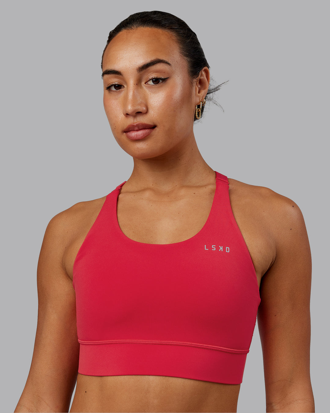 Woman wearing Accelerate Sports Bra - Scarlet