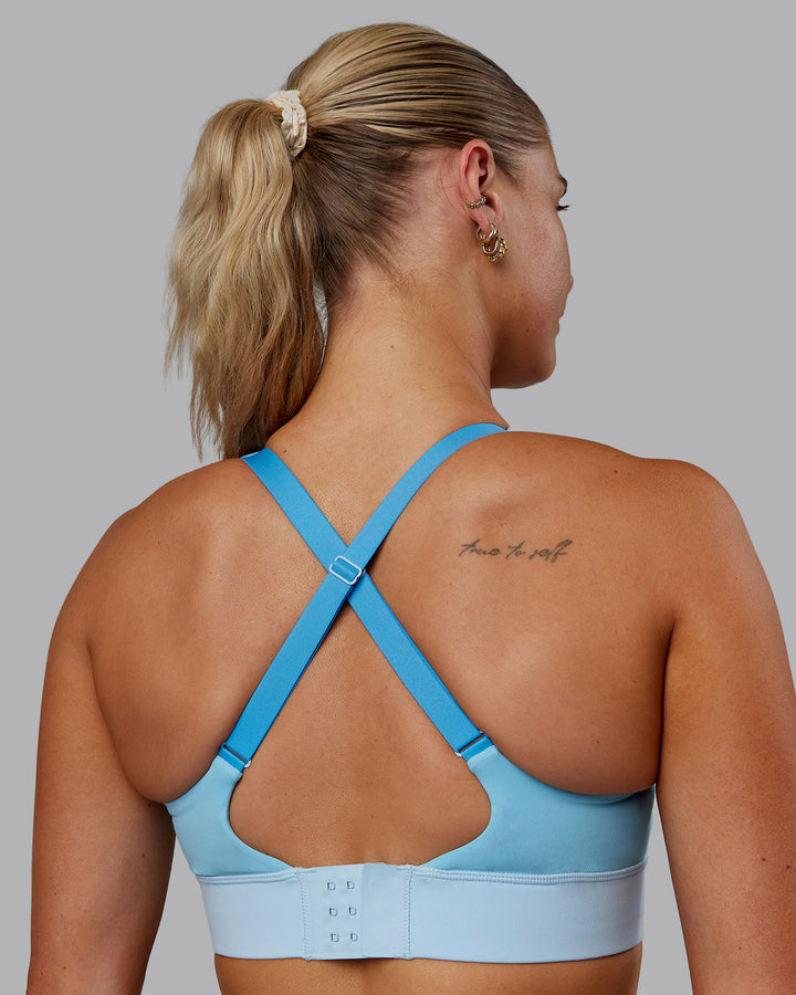 Woman wearing Accelerate Sports Bra - Sky Blue Colourblock
