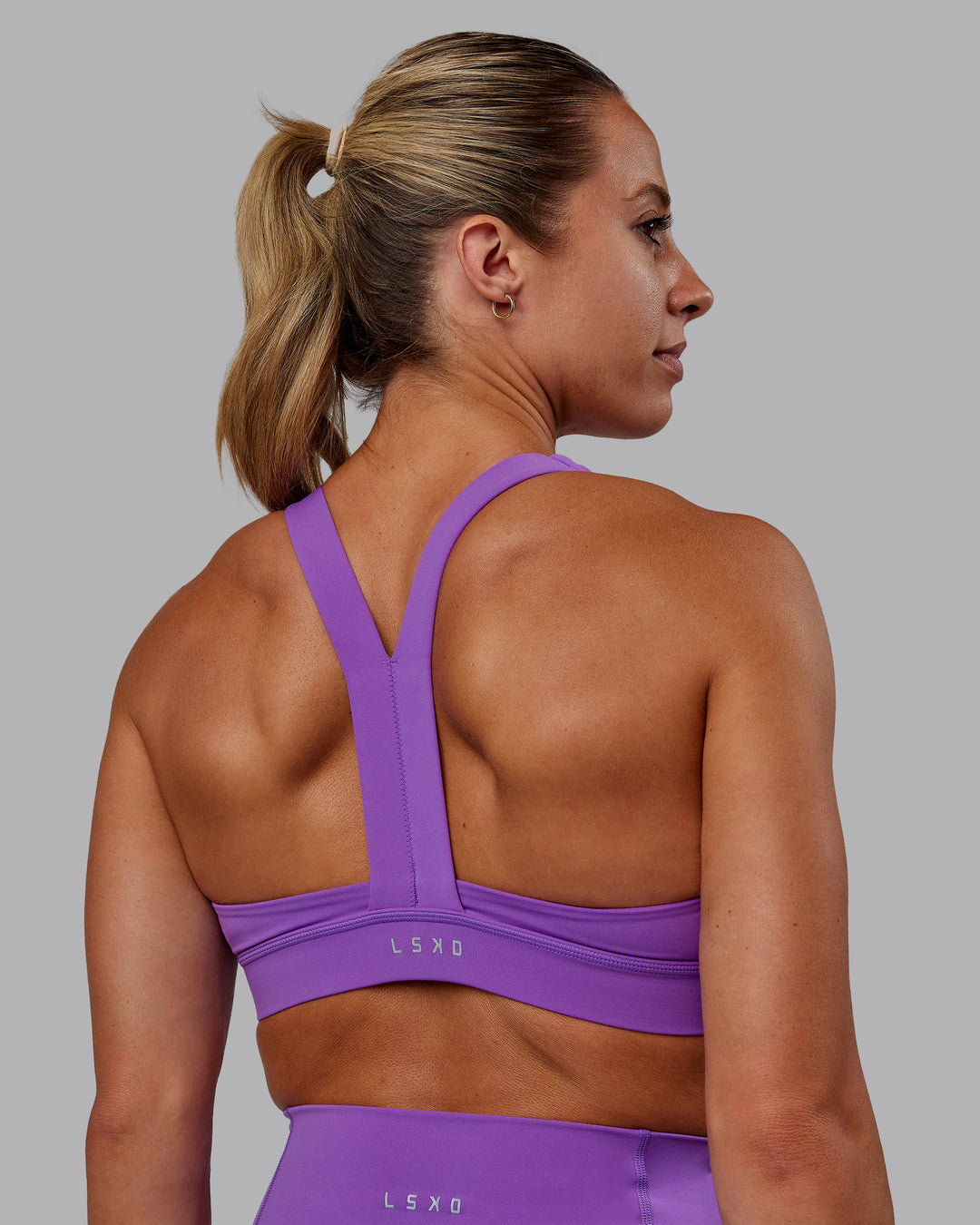 Woman wearing Advance Sports Bra - Purple Swirl