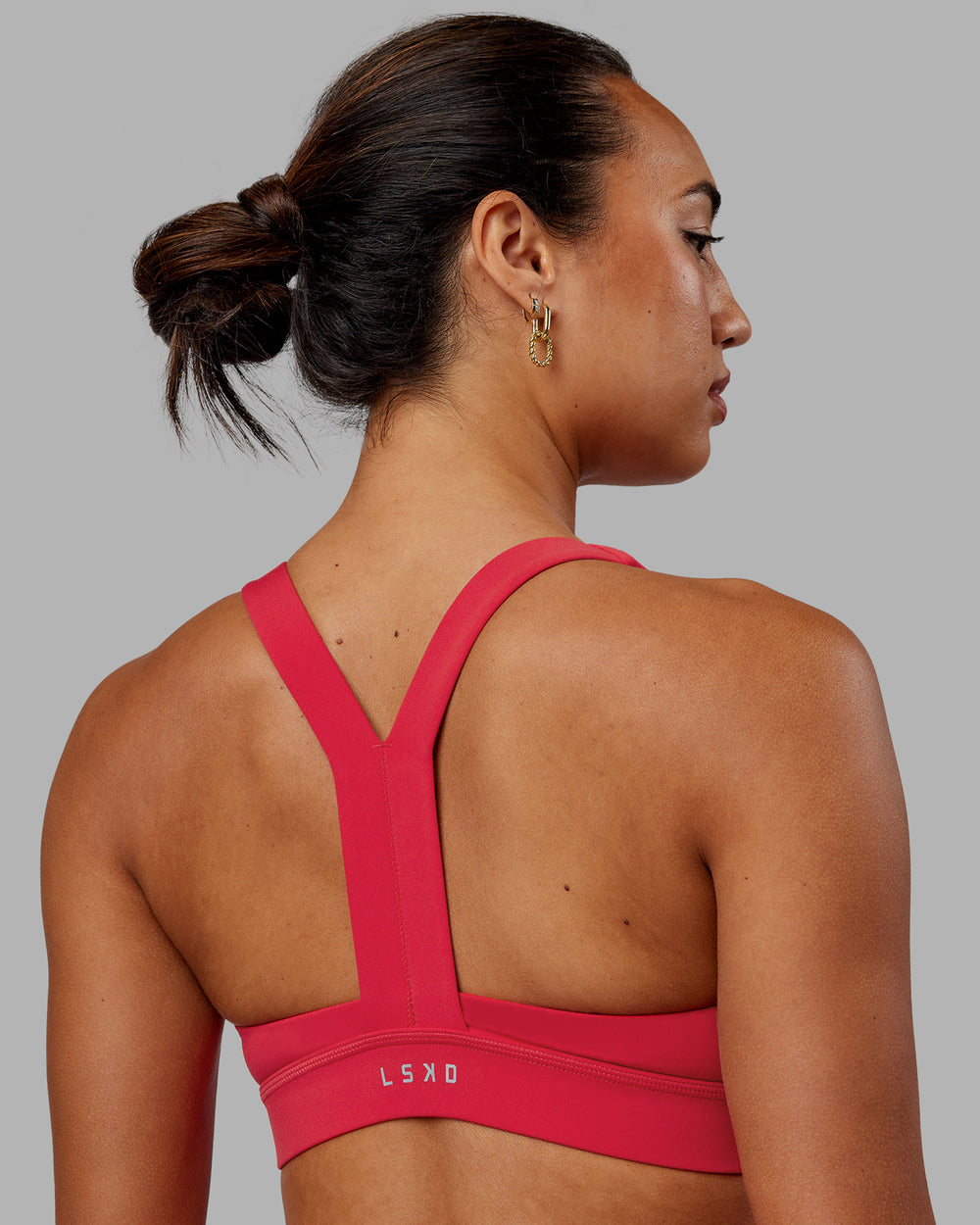 Woman wearing Advance Sports Bra - Scarlet