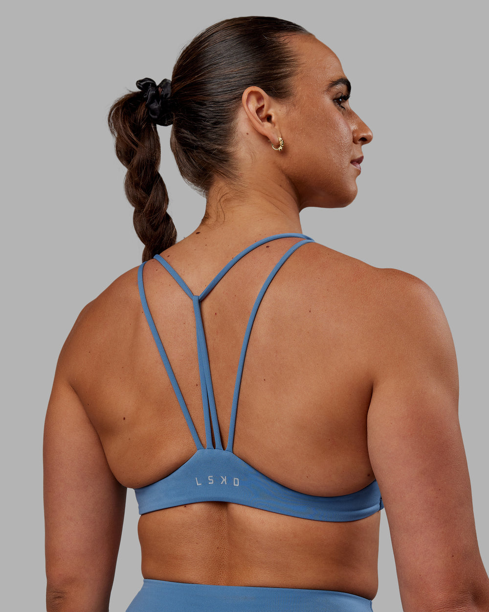 Woman wearing Agile Sports Bra - Elemental Blue