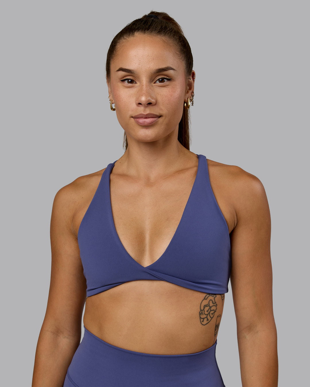 Woman wearing Agile Sports Bra - Future Dusk