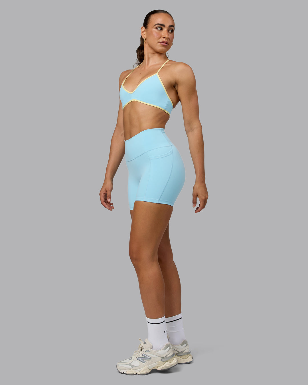 Woman wearing Ambience Sports Bra - Crystal Blue-Lemon