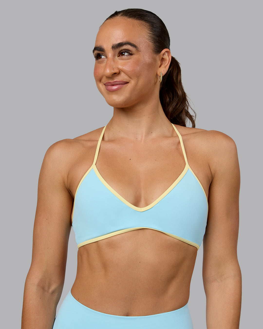 Woman wearing Ambience Sports Bra - Crystal Blue-Lemon