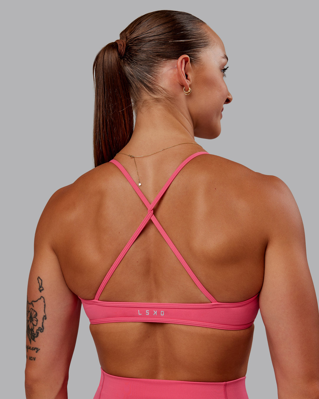 Woman wearing Ambience Sports Bra - Hot Pink