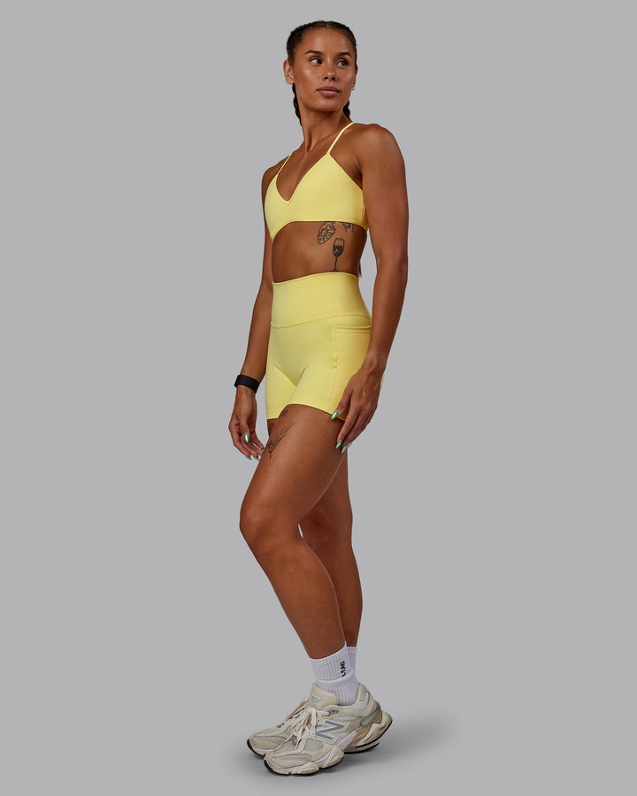 Woman wearing Ambience Sports Bra - Lemon Fizz
