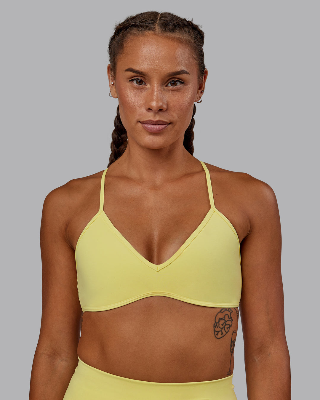 Woman wearing Ambience Sports Bra - Lemon Fizz