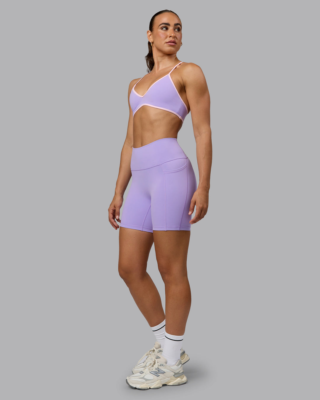 Woman wearing Ambience Sports Bra - Pale Lilac-Pale Pink