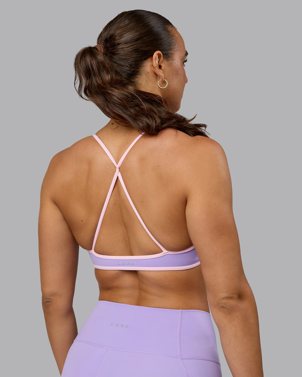 Woman wearing Ambience Sports Bra - Pale Lilac-Pale Pink