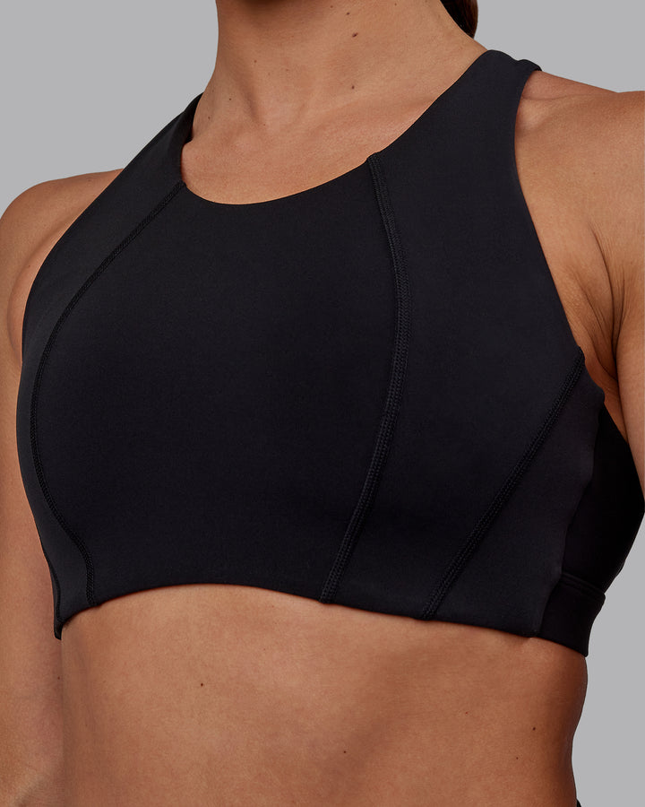 Woman wearing Ascent Sports Bra - Black
