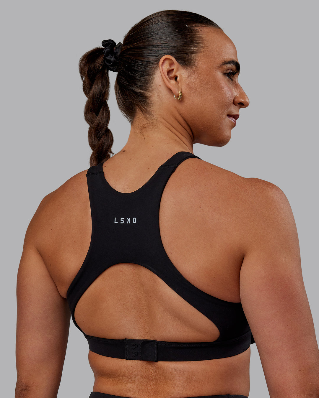 Woman wearing Ascent Sports Bra - Black