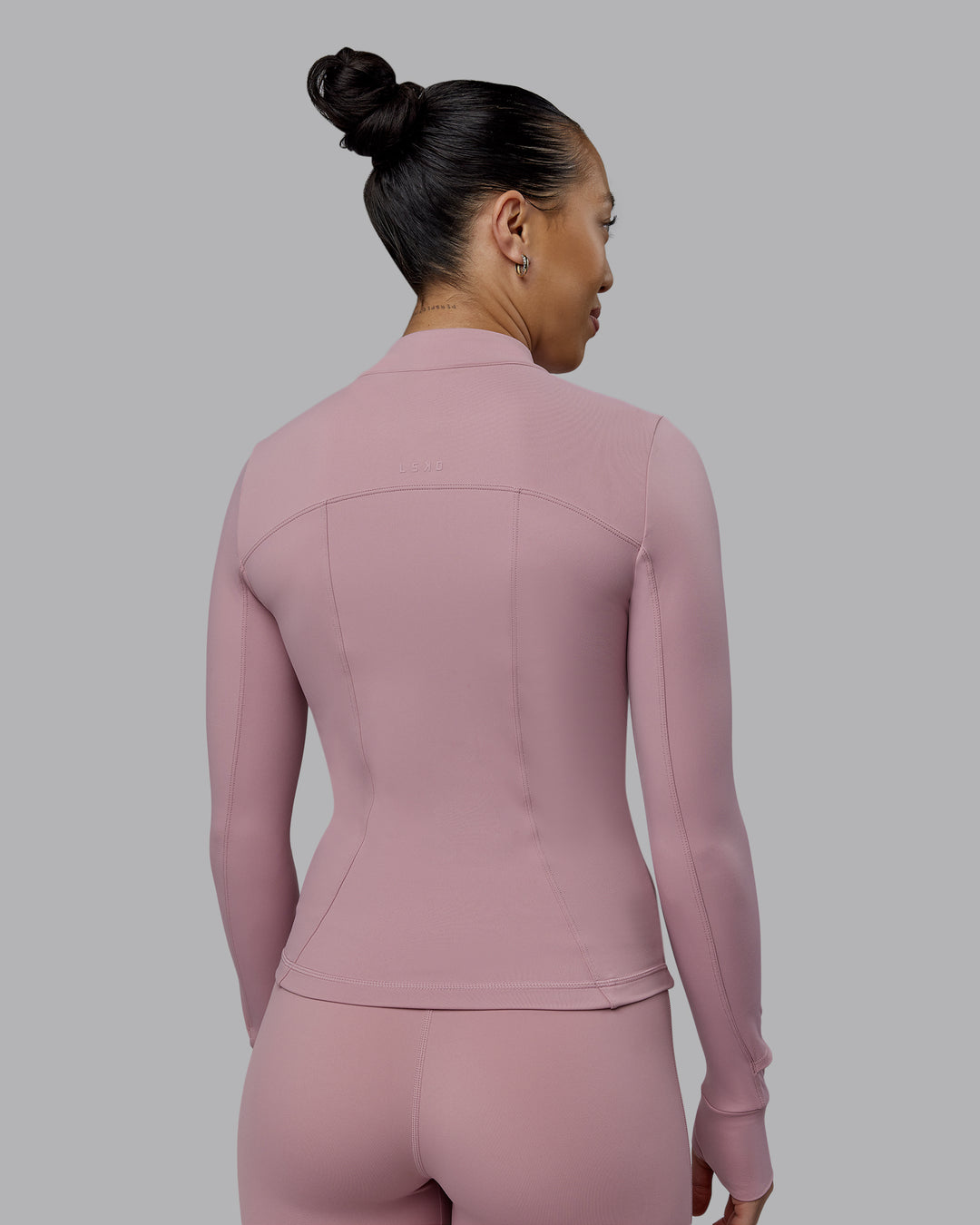 Woman wearing Aspire Jacket - Cosmetic Pink