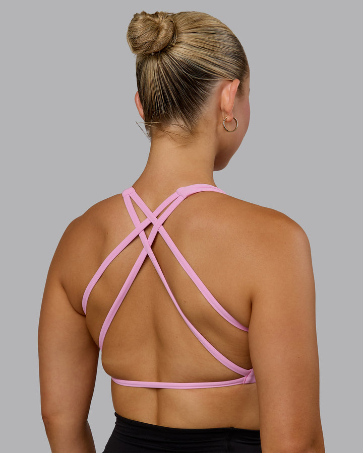 Woman wearing Aspire Sports Bra - Bubblegum
