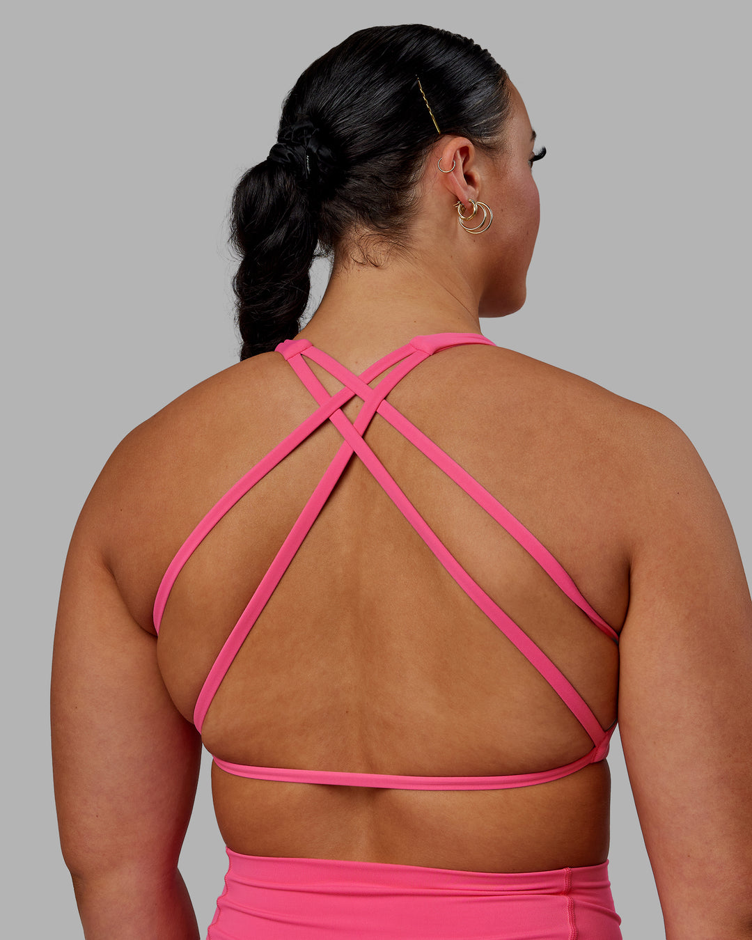 Woman wearing Aspire Sports Bra - Carmine Rose