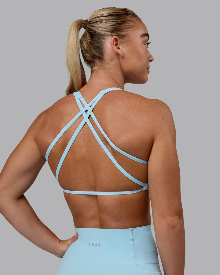 Woman wearing Aspire Sports Bra - Glacial Blue
