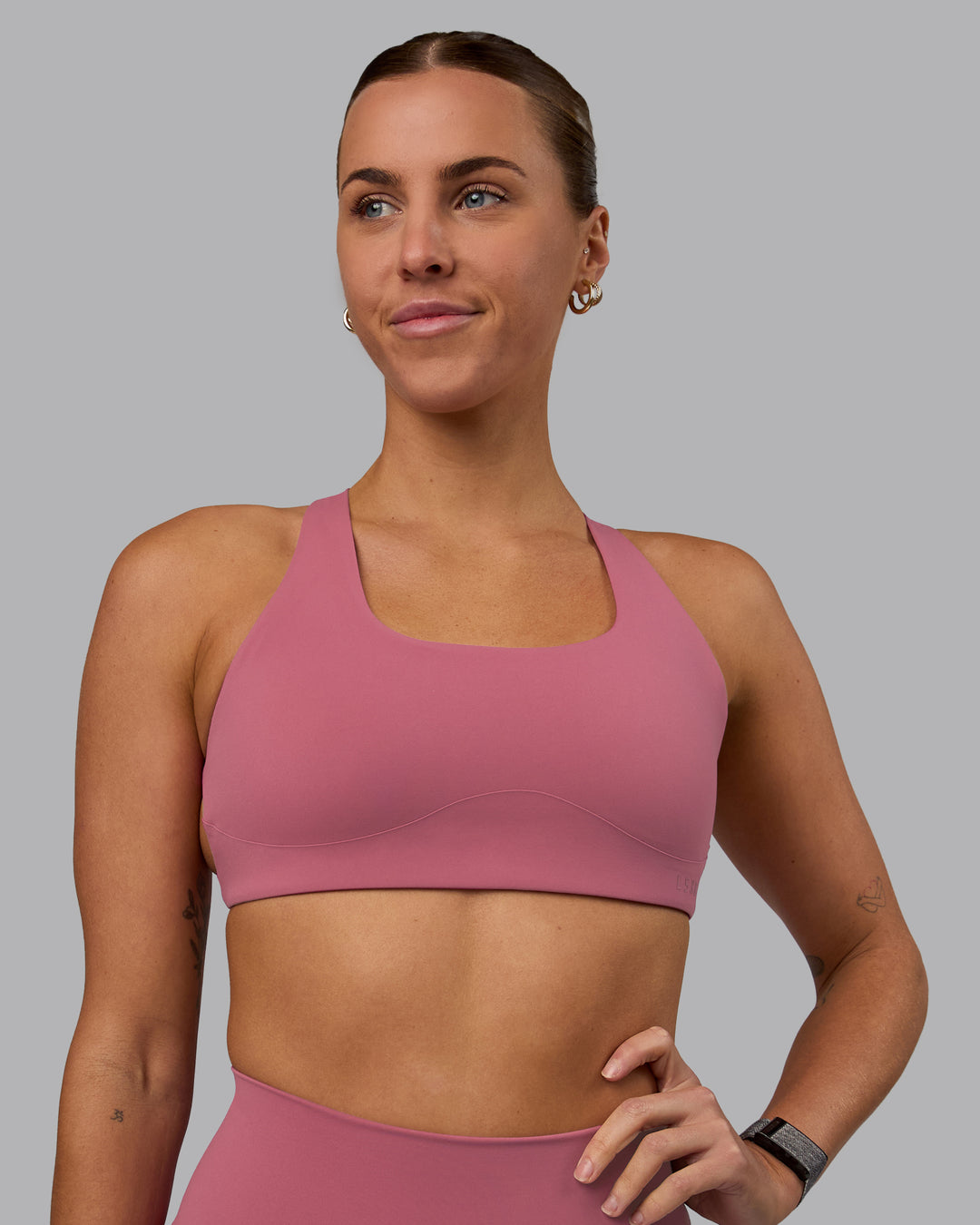 Woman wearing Aspire Sports Bra - Mauve Haze