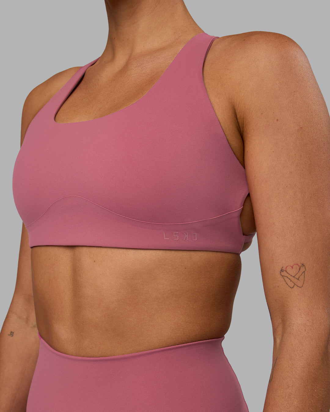 Woman wearing Aspire Sports Bra - Mauve Haze