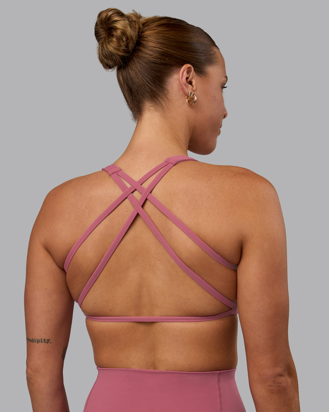 Woman wearing Aspire Sports Bra - Mauve Haze